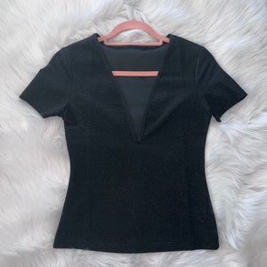 V-neck T-shirt; black and glittery. Does not leave glitter behind.